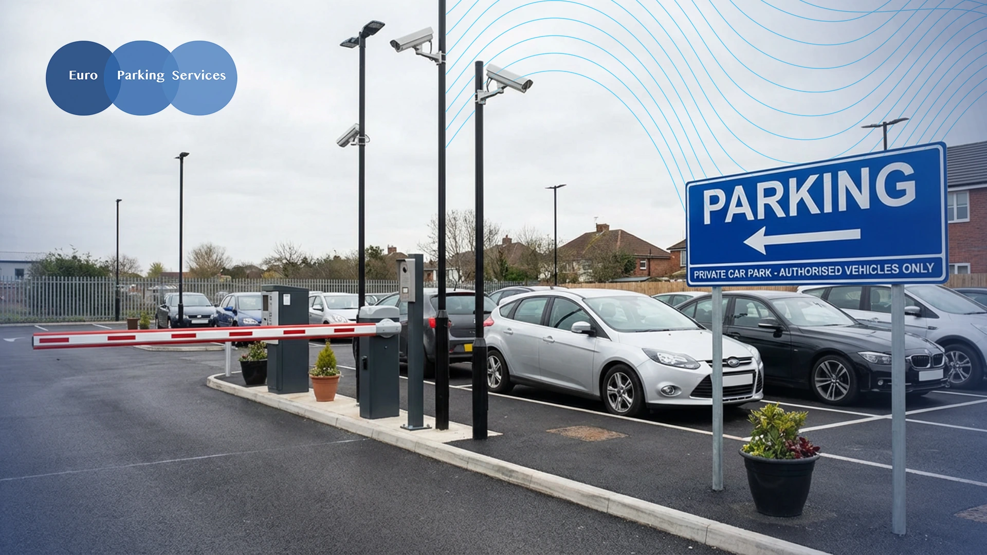 A man using a pay and display parking machine in a car park with parked cars